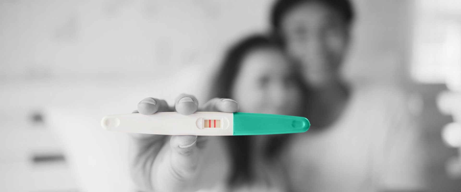 excited-new-parent-hand-show-pregnancy-test a